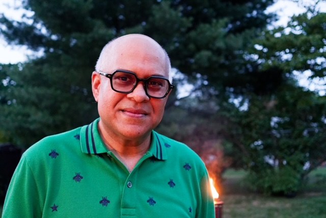 Chico in a green Gucci polo with bee and star embroidery