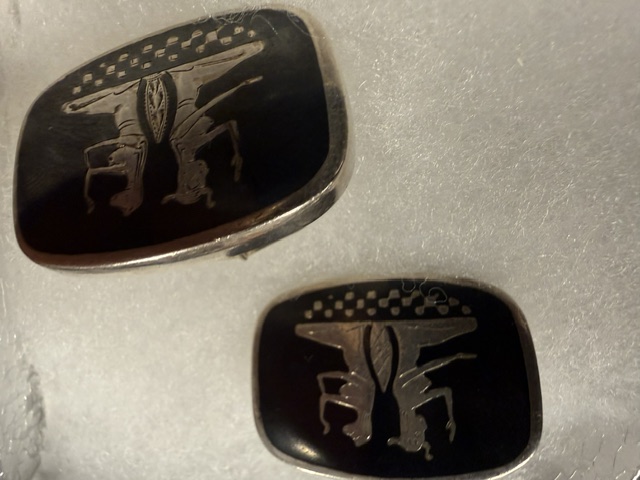 A pair of vintage silver and black onyx cufflinks with classical figures