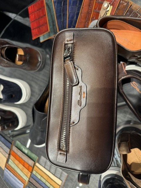 A Santoni dopp kit in brown leather